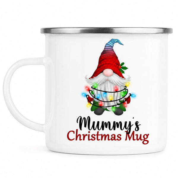 A white enamel-style mug with a silver rim, featuring a Christmas gnome illustration and the text 'Mummy's Christmas Mug' on the front, shown on a plain white background.