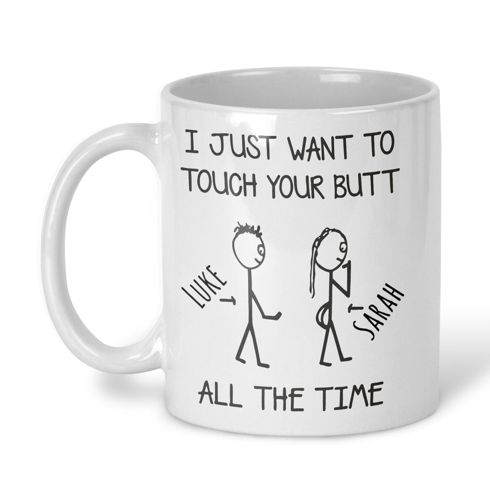 A white ceramic coffee mug with a black printed graphic and text that reads 'I JUST WANT TO TOUCH YOUR BUTT ALL THE TIME' with stick figures. Personalise with any names