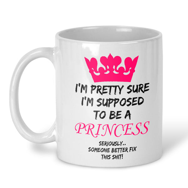 A white ceramic coffee mug with a pink crown graphic and the text 'I'M PRETTY SURE I'M SUPPOSED TO BE A PRINCESS SERIOUSLY.