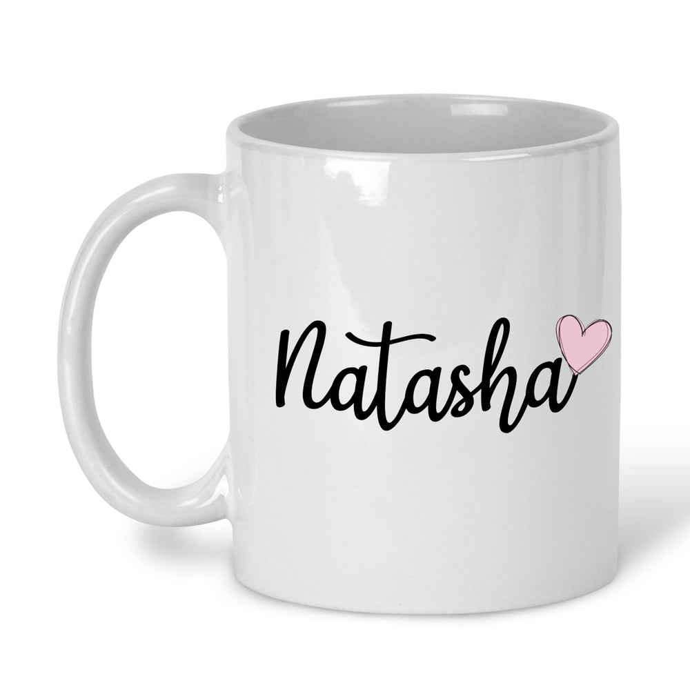 A white ceramic mug with a personalised name in black script and a pink heart symbol below the text.